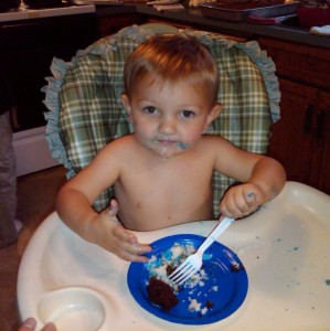 Obligatory cake photo. Good thing Hannah strips him down to his nappy.
